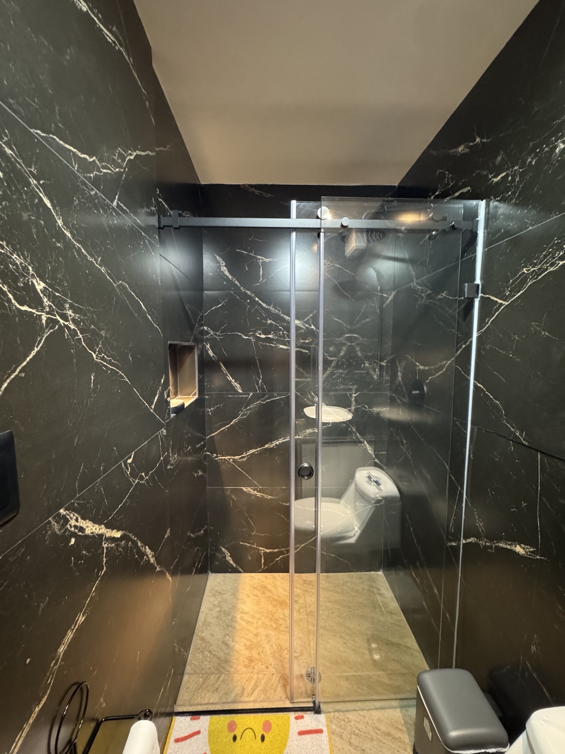 Shower with a glass enclosure