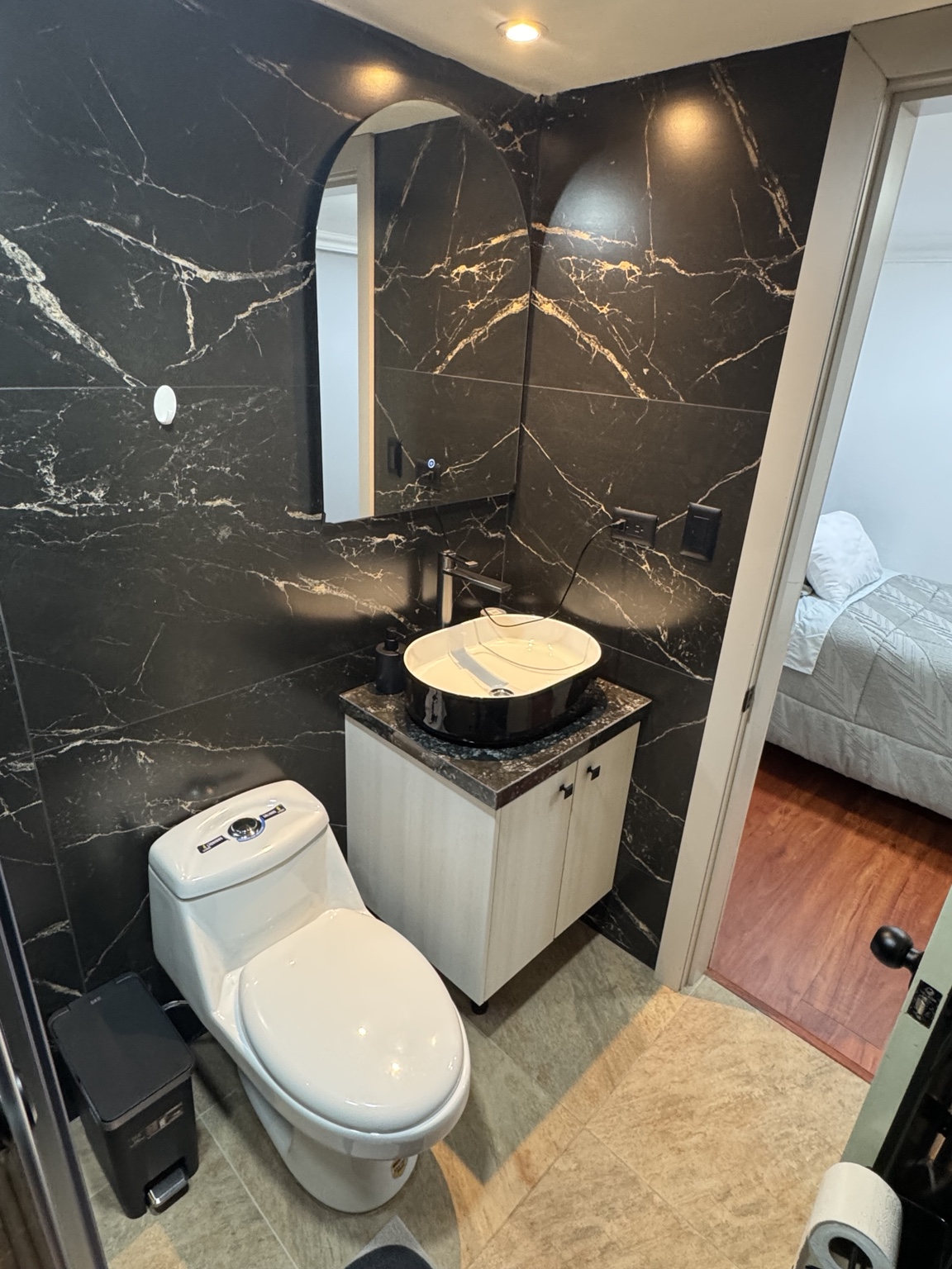 Bathroom basin, mirror and toilet