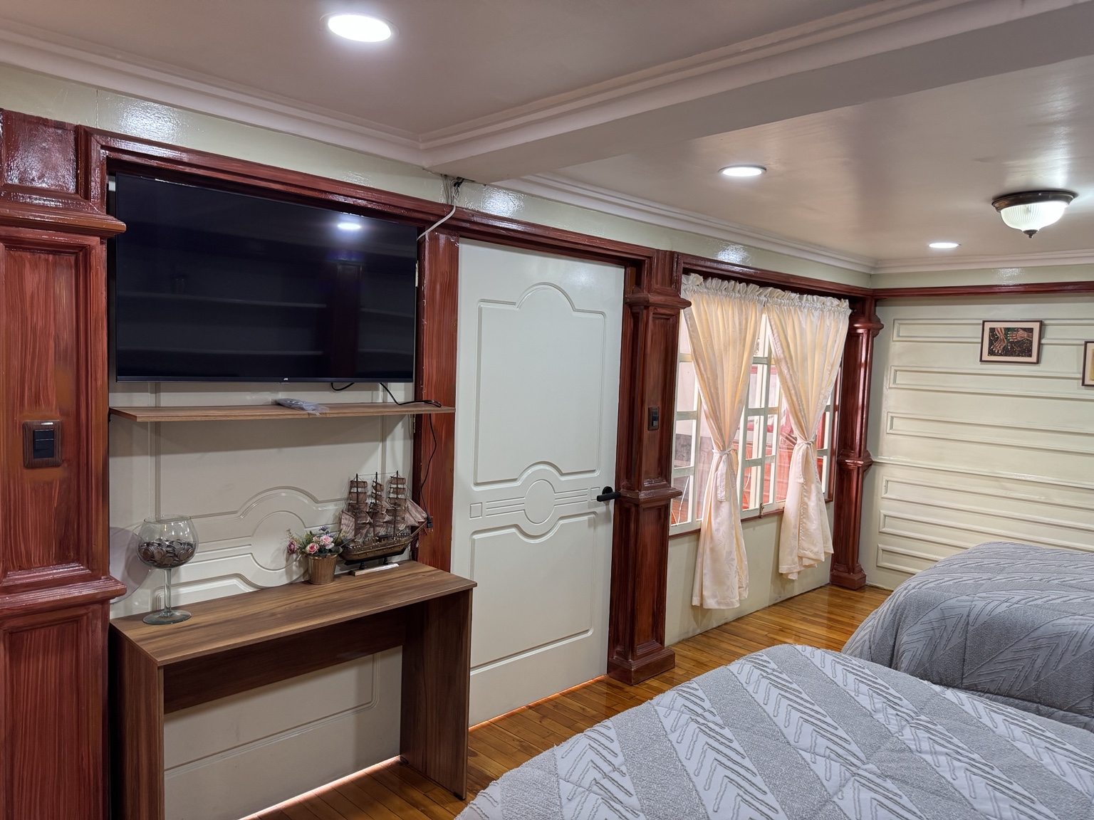 Television, desk and bedroom windows